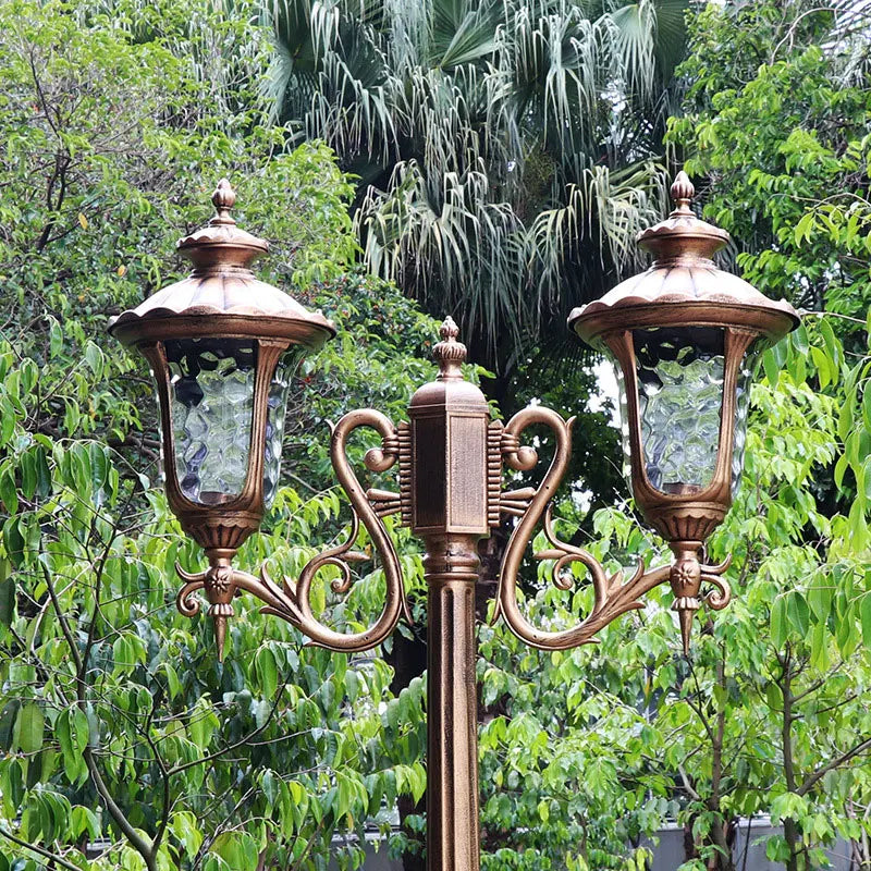 lampadaire extérieur or noir verre translucide vintage élégant détails sculptés deux lampes abat jours