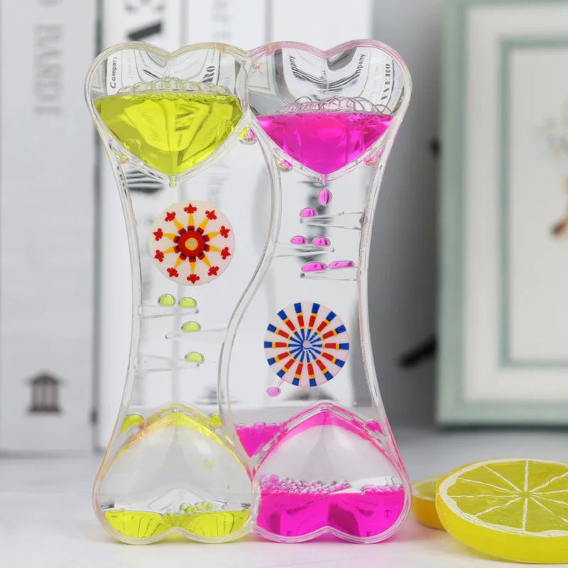 minuteur sablier liquide bicolore transparent motifs géométriques souriant deco moderne