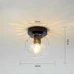 lampe moderne verre transparent noir doré élégante sphérique éclairage contemporain