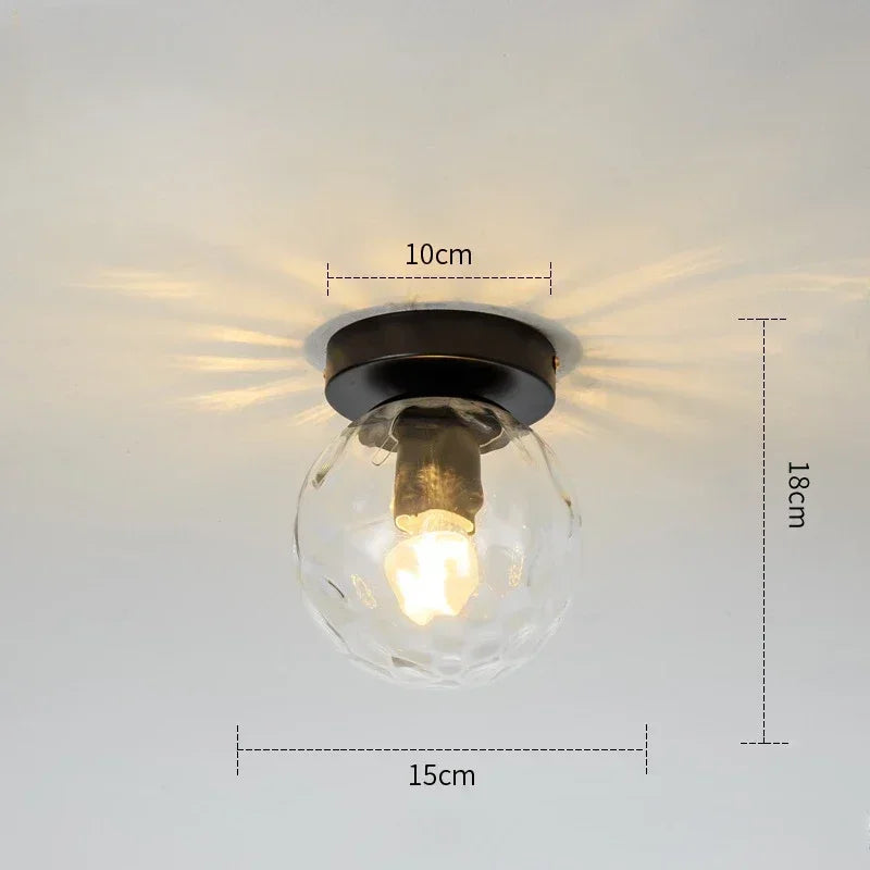 lampe moderne verre transparent noir doré élégante sphérique éclairage contemporain