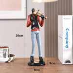 statues miniatures musiciens guitare saxophone trombone batterie décoration intérieure moderne stylisée