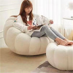 fauteuil moderne velours bouclé doux repos pieds beige clair intérieur meubles salon contemporain