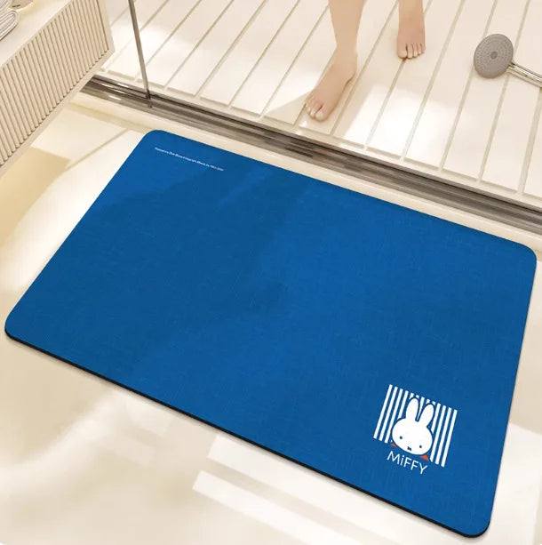 tapis bain dessin animé lapins gris jaune vert bleu rayures enfantin absorbant