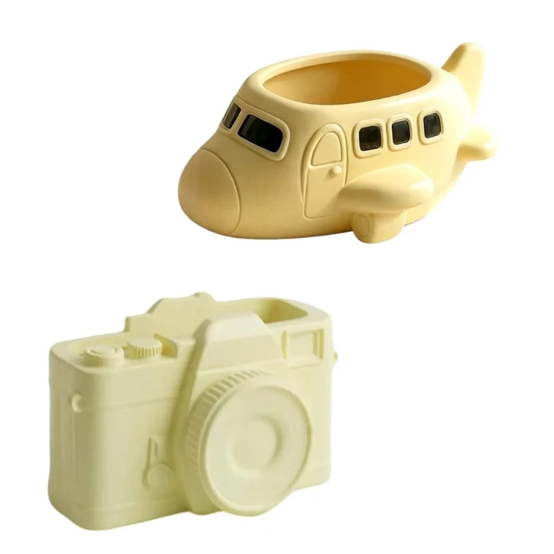 pots decoratifs forme avion appareil photo couleur jaune pâle surface lisse aspect mat decoratif