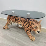 table basse moderne léopard rose vif orange noir verre opaque pieds solides animalier