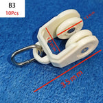 rouleaux rideaux blancs anneaux métalliques modernes quincailleries fixations poulies tringles curseurs roues mat inoxydables