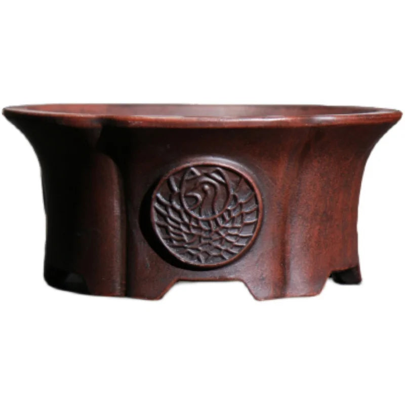 cache pot marron foncé texture bois gravure circulaire finition glacée classique plante verte chambre