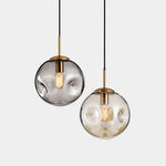 suspension lumineuse moderne transparente dorée ampoule câble noir minimaliste salle manger chambre