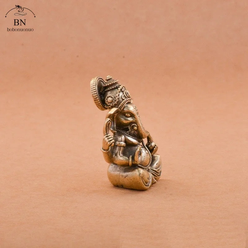 statuette ganesha bronze doré sculptée details complexes religieuse traditionnelle décoration intérieure éléphant dieuhindou ornement