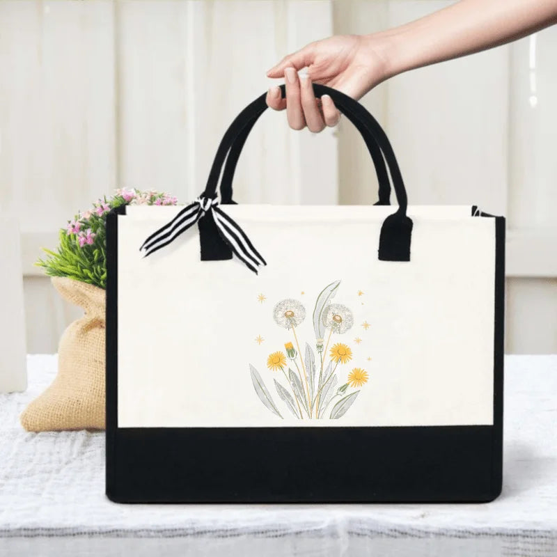 sac main toile fleurs jaunes vertes fond beige moderne poignées noires respectueux environnement réutilisable