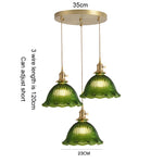 suspension lumineuse vintage vert doré motifs géométriques ampoules câbles chaînes métal