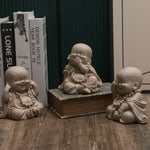statuettes bouddha enfant résine beige clair marron motifs dorés zen