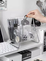 rangements transparent moderne compartiments stylos telephone livre rubans maquillage calendrier notes clavier
