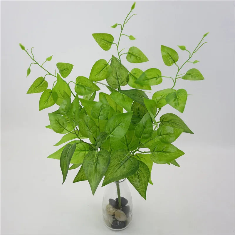 plantes artificielles violet vert marron feuilles ovales moderne décoration extérieure vase galets noirs blancs