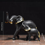 statues éléphants résine blanc noir or détails dorés classique élégant animal compagnie feng shui