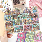 puzzle multicolore art deco détails bâtiments adhésif pièces boite rangement lunettes