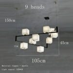 suspension lumineuse moderne marbre noir blanc or rose fixée câbles chambre salon