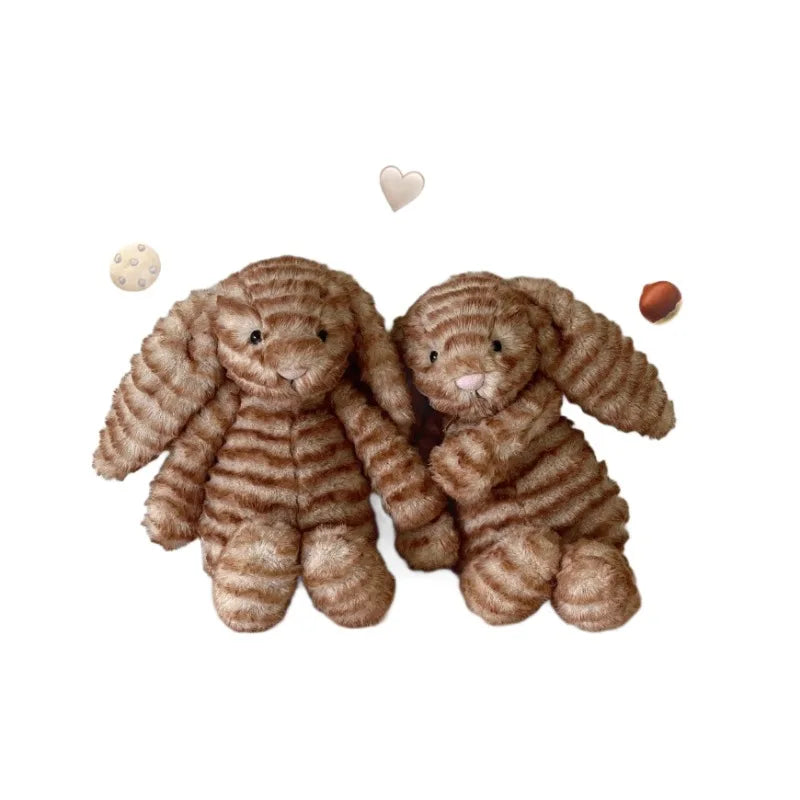 peluche lapin marron clair rayures horizontales classique robe blanche dentelle ruban blanc chambre salon
