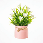 bouquet artificiel fleurs modernes ruban jute accroché extérieur exposition anniversaire orange blanc rose violet