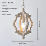 suspension lumineuse bois ornements sculptés finition rustique classique vintage blanc beige salle manger restaurant