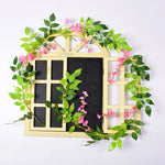 guirlande végétale naturelle fleurs vertes violettes blanches roses extérieur décoration maison jardin mariage festivités