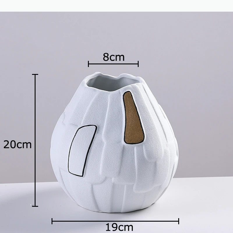 vase moderne texturé découpes géométriques lignes noires blanc doré marron