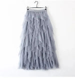 jupe plissée rose clair tulle élégante féminine streetwear élastiquée mi mollet translucent anneaux suspension