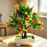 décoration intérieure arbre artificiel bonsaï pot blanc feuilles vertes fruits rouges tronc brun
