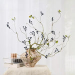 décoration intérieure branche artificielle feuilles automne baies rouges vert ornement hiver naturel rustic maison