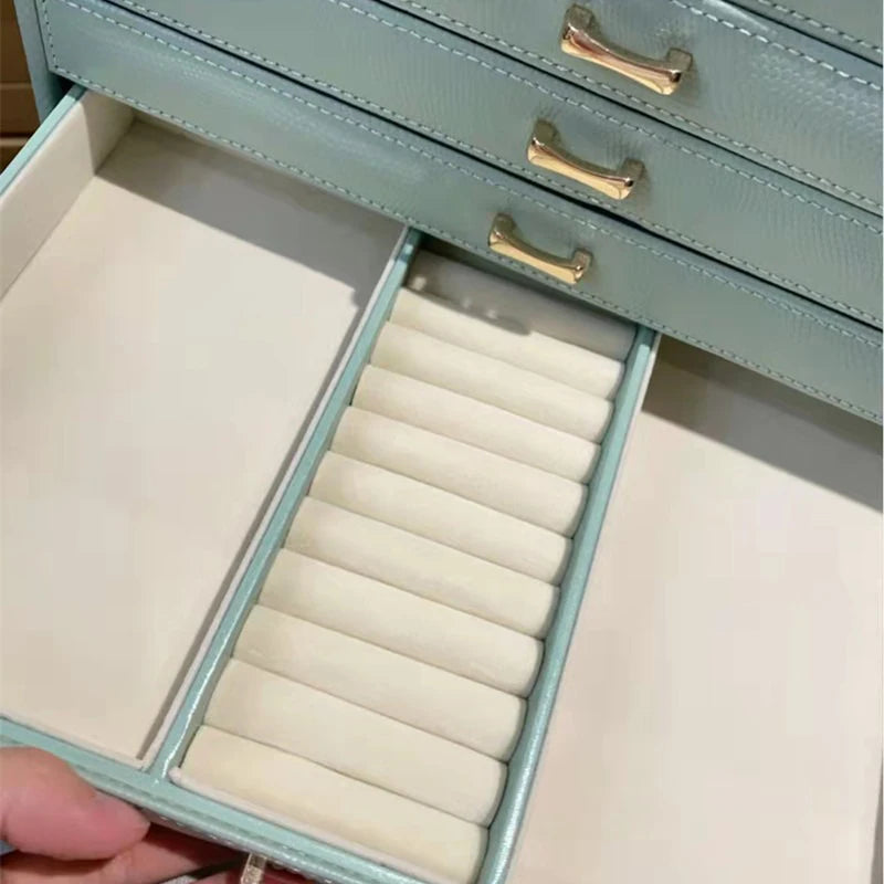 boîte bijoux cuir vert pastel compartiments velours classique poignées dorées grands bijoux rangement transporte