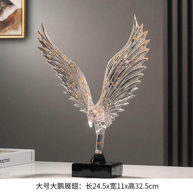 statuette animale moderne transparente dorée oiseau cerfs ailes déployées base noire