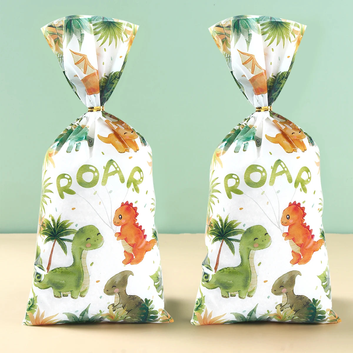 supports cupcakes dinosaures palmiers happy birthday assiettes gobelets sacs cadeaux vert orange blanc enfants