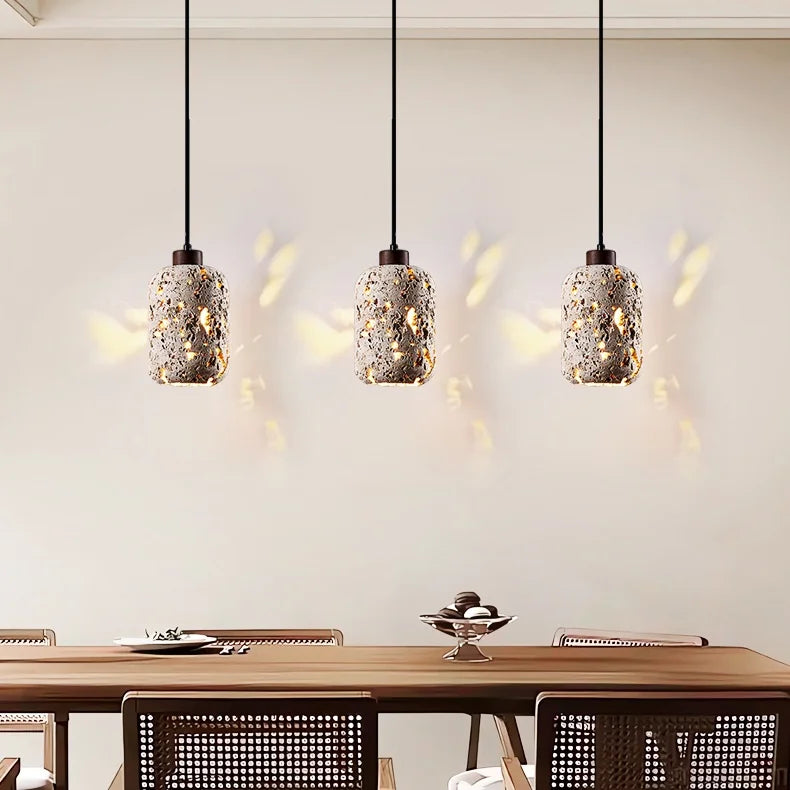 suspension lumineuse moderne pierre texture granulée gris beige noir éclairage ambiance chambre salonhôtel