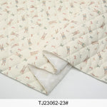 tissu imprimé fleurs lapins blanc rose vert bleu clair vintage enfantin résistant déchirure bricolage
