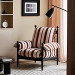 fauteuil rembourré moderne scandinave assise rayée couleur marron rouille coussins pieds apparents