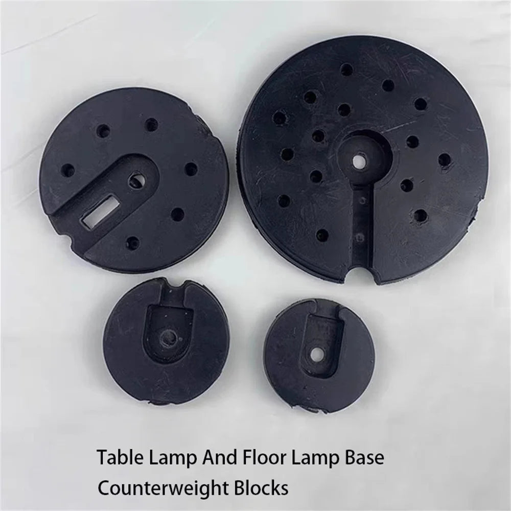 contrepoids base lampe table sol noir rond lisse perforations moderne fixations bloque poids