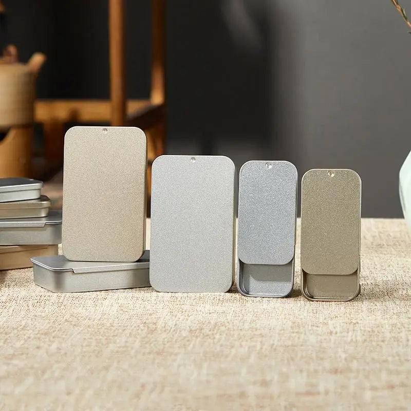 boîtes métalliques rangement bijoux gris clair minimaliste couvercle coulissant portables opaques