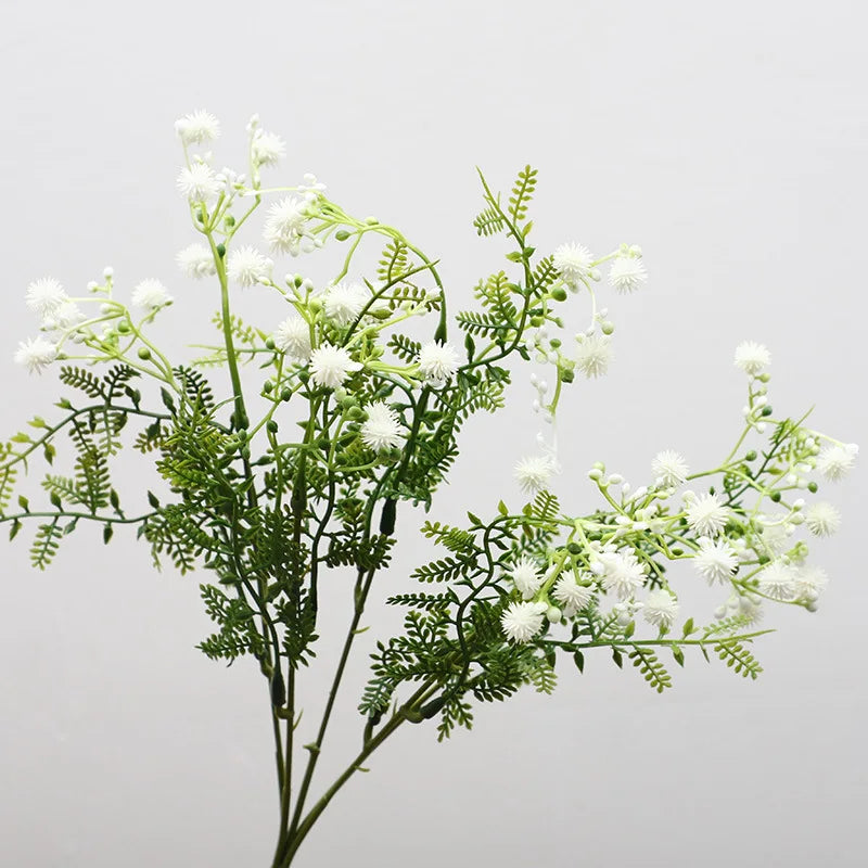 décoration intérieure bouquet artificiel feuilles vertes fleurs blanches jaunes roses naturel salon jardin