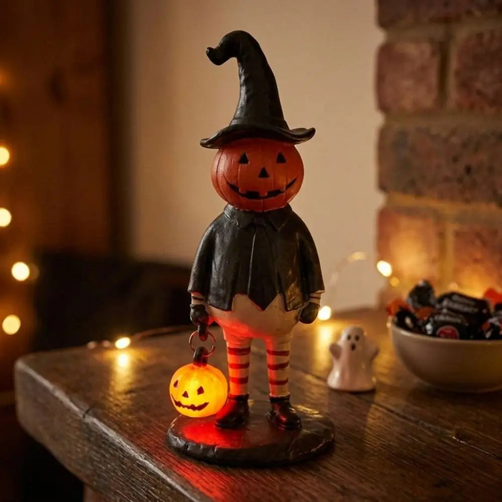 figurine halloween citrouille lumineuse orange visage chapeau robe noire bas rayés automne