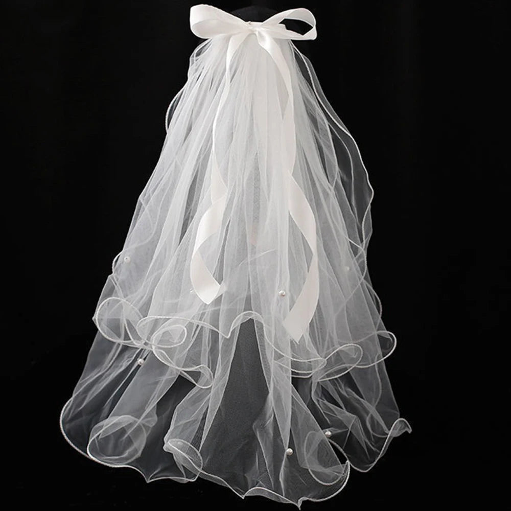 voile mariée tulle plissé blanc classique romantique fixé noeud transparent élégant