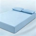 parure lit bleu clair drap housse élastique deux oreillers coton doux chambre moderne