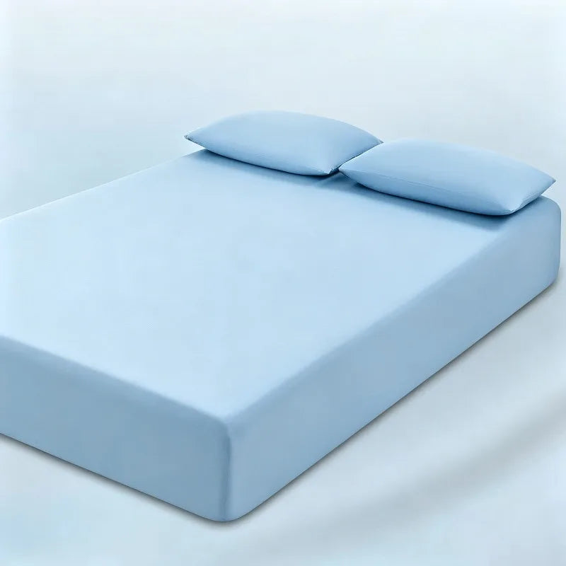 parure lit bleu clair drap housse élastique deux oreillers coton doux chambre moderne