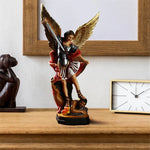 statue saint michel archange terrassant démon or noir rouge texture plumes religieuse