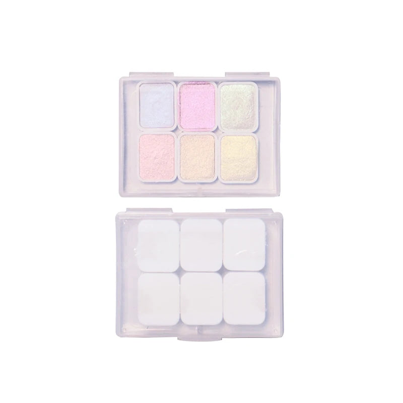 peintures aquarelle palette compacte bleu vert violet rose beige jaune blanc texture granuleuse opaques
