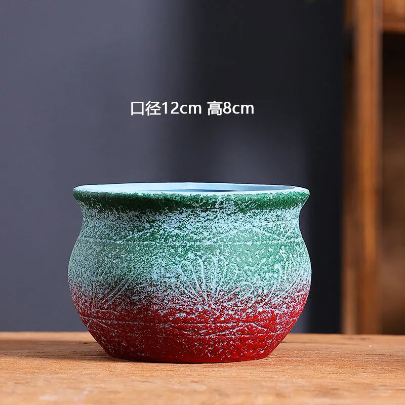 cache pot céramique artisanal méditerranéen couleurs vives motifs texturés plante verte intérieur moderne