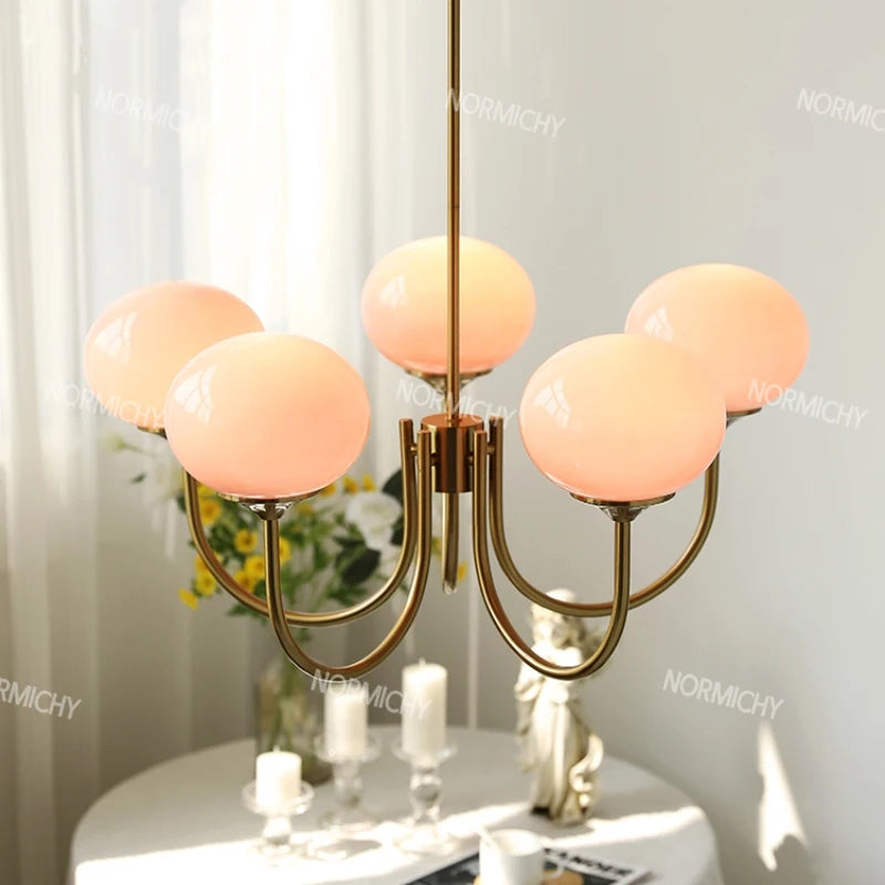 lustre moderne élégant doré rose blanc sphères translucides structure métallique opaques chambre restaurant exposition