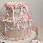 décoration gâteau mariage ruban nœud rouge rose glaçage texturé nacrées festive