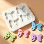 moule silicone nœuds papillons pâtisserie décorative couleurs variées fondant cupcakes