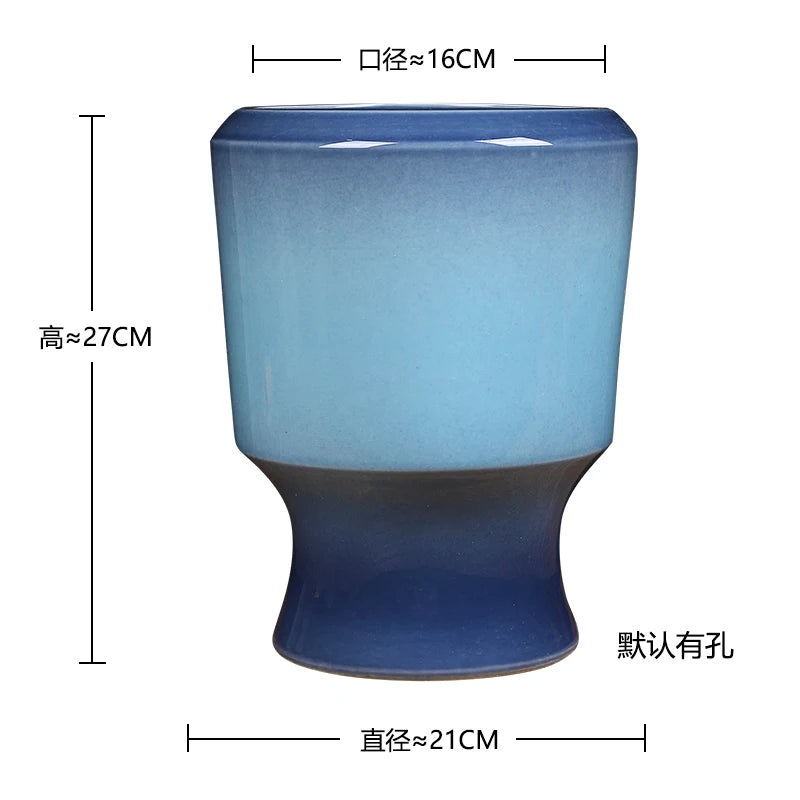 Vase en céramique de couleur bleue avec une forme unique et des mesures indiquées, idéal comme accessoire de décoration d'intérieur.