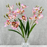 bouquet fleurs artificielles orchidées cymbidium roses blanches violettes jaunes décoration intérieure maison moderne minimaliste